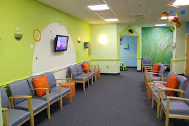Great reception and waiting room ideas, including tables, chairs and office decor that will keep kids and families entertained at the dental office! Holliston Pediatric Group By Chic Redesign Kid Friendly Waiting Room For Pediatric Hospital Interior Design Waiting Room Design Pediatric Waiting Room Ideas