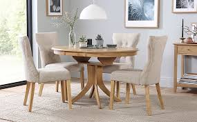 Ranging from industrial looking extending tables to super sleek glass top extending tables, there's something to suit everybody's style. Hudson Round Oak Extending Dining Table With 4 Bewley Oatmeal Fabric Chairs Furniture And Choice