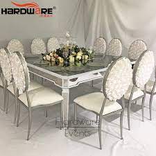 If you're styling is more contemporary, any of the modern mirrored dining tables available will add to the chic look. China Lxury Mirror Glass 12 Seater Mirror Glass Top Dining Table Set China Triangle Glass Dining Table Cheap Table And Chair Rentals