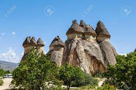 View Of Famous Sandy Fairy Chimneys In Pasabagi Monks Valley, Cappadocia  Area, On Bright Blue Sky Background. Stock Photo, Picture and Royalty Free  Image. Image 76932996.