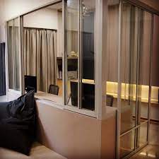 The tropical tone of the wooden floor prevents the room from being overwhelming and the scandinavian style chairs add an aura of modern comfort. By Using Movi Sliding Door At Half Wall You Maintain An Open Space While Defining Two Distinct Areas Room Divider Screen Room Divider Decorative Room Dividers