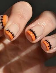 The nails are filed into a square shape, but give how cool is this orange nail design? Modern Halloween Ideas For Spooky Nail Designs