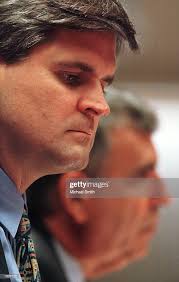 AOL Chairman Steve Case listens as Time Warner Chairman Gerald Levin...  News Photo