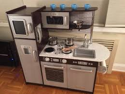 Featuring beautiful light wood details, this sleek kitchen offers up exceptional features that will keep kids engaged. Kidkraft Uptown Espresso Kitchen Review First Impressions Mommy To Max