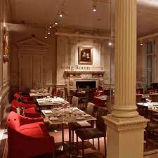Morgan's library, in which soft red tones predominate; Lovely Intimate Museum Restaurant The Curious Cowgirl