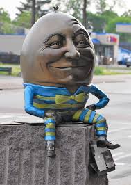 Little girl reading statue by ec library