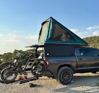 Aluminum truck cap and tent setup for overlanding