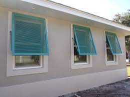 Bahama Shutters In Teal Liven Up This Sarasota Home Bahama Shutters Outdoor Shutters Shutters