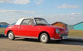 Didelė ir patyrusi grožio meistrų komanda pasiruošusi padėti. Red Nissan Figaro Editorial Stock Photo Image Of Beach 76961153