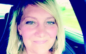 White woman files discrimination suit — claims she didn't get athletic dir.  job because she was married to Black man