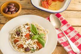 This Simple Greek Spaghetti Recipe Only Takes 30 Minutes To Make Capers Oregano Olives And Feta Cheese A Greek Spaghetti Greek Dishes Mediterranean Recipes