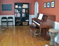The Studio Simple Clean Multiples One Chalkboard One Drum One Piano Two Chairs Two Bookcases Three Small Pictures Perfe Piano Room Piano Home Decor