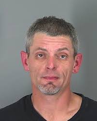 NEW DETAILS: Officials released a photo of the "armed and dangerous"  mugshot" who remains