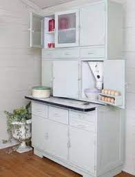 The metal can easily be cleaned with a damp cloth so you can store anything from cleaning supplies, pantry items, or extra throws and board games. 1950s Kitchen Larder Cabinet