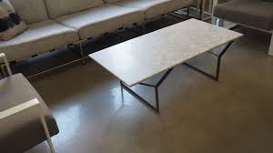 White marble veneer over an engineered wood top. West Elm Y Base Marble Coffee Table Apartment Therapy S Bazaar