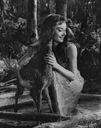 Audrey Hepburn and her pet deer on the set of Green Mansions in 1958