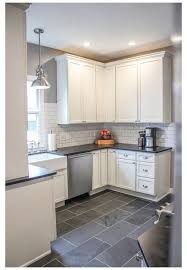 This cook space, for instance, combines farmhouse elements like the sink and the subway tile with dark slate floors. Pai Play 38 Grey Kitchen Floor Ideas