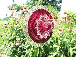 Tutorial shows both how to drill through glass or make them without drilling. 20 Upcycled Garden Glass Flowers Made Of Old Plates