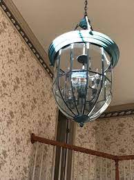A beautiful example of a pendant the large foyer lighting fixture represents an open wrought iron sphere that is surrounded by 6. How To Clean Open Light Fixture 14 Ft Up In Open Foyer Hometalk