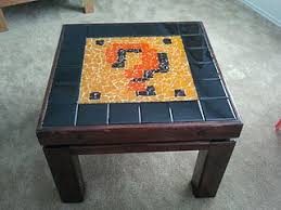 Here S The Super Mario Question Block Table That D And I Made For Link S Playroom Over The Summer And I Finally Got Nerd Crafts Mosaic Table Cool Coffee Tables
