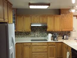 Get the same effect with metallic details like a stainless steel. How To Update Old Kitchen Lights Recessedlighting Com