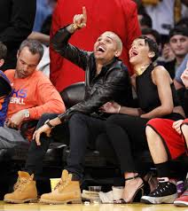 Rihanna sits courtside as chris brown plays in charity basketball match, singer looks seriously unimpressed: Chris Brown And Rihanna Go To Nba Game 12 Chinadaily Com Cn