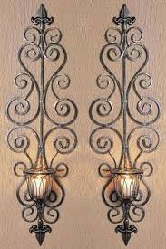 These iron floor candle holders are sturdy enough to support larger candles, and not fall ove… give your home a gothic feel with iron floor candle holders. Loading Iron Wall Candle Holders Wrought Iron Wall Decor Wall Candle Holders
