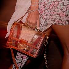 This versatile silhouette can be worn as a handheld, shoulder bag or crossbody. Coach On Instagram A Bag That Makes Waves Direct From The Runway In Shanghai Our Riley Gets Reimagined With Curved Patchwork A Brass Bags Coach Coach Bags
