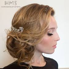 Braided bun on the side with a flower accent. Side Updos That Are In Trend 40 Best Bun Hairstyles For 2021