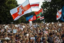 Man lies on the ground in front of riot police during a protest after polls closed in belarus' presidential election, in minsk on august 9, 2020. Why Are Protesters In Belarus Using The White Red White Flag Euromaidan Press News And Views From Ukraine