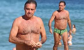 He constantly argues with, harasses and laughs at his guests. Andrew O Keefe Looks Solemn During A Swim At Bondi Beach Daily Mail Online