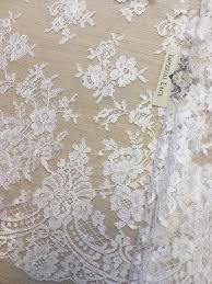 This white chantilly lace is an extremely fine point lace featuring a pretty 3d guipure floral appliqué. White Lace Fabric Chantilly Lace Lace Fabric From Imperiallace Com
