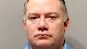 Ex-Detroit police officer accused of using prisoners' debit cards to  embezzle