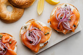 Toss lettuces to combine, then top with cucumbers, cherry tomatoes, avocado, red onions, cooked eggs, and smoked salmon as shown. Smoked Salmon Cream Cheese And Capers Bagel Recipe