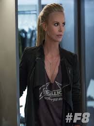 After offing one of the toretto family's loved ones and parachuting away from her airbase in the fate of the. Fast 8 Charlize Theron Black Jacket Charlize Theron Hair Charlize Theron Beautiful Celebrities