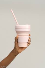 download premium image of hand holding a pink silicone collapsible cup collapsible cup cup starbucks inspired ice coffee