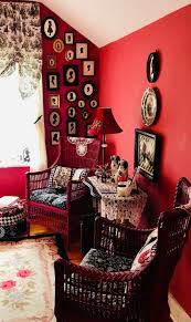 Red Walls Emphasize The Black White Silhouettes Collection Living Room Decor Paint Colors For Living Room Living Room Tv Wall