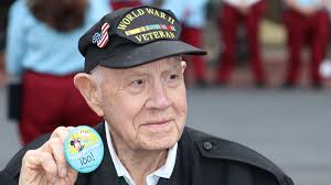 Disney's Magic Kingdom honors 100-year-old WWII veteran during flag retreat  ceremony