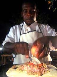 Pizza In Zanzibar S Forodhani Gardens Night Market It S An Omelet Pizza Hybrid That Looks Absolutely Scrumptious Street Food Africa Food African Food