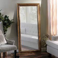 The worn antique finish of the farmhouse mirror collection adds timeless country style and rustic flair to any room in the home. Antique Gold Full Length Mirror 32x66 In Kirklands