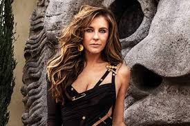 Hurley's black versace dress, riven with deep slits and seemingly held together by a string. Elizabeth Hurley Revisits The Versace Dress That Put Her On The Map In 1994