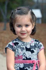 I spray their hair with water, brush it into a high ponytail and then twist the hair before wrapping it around itself and securing it with another rubber band. 29 Cutest Hairstyles For Little Girls For Every Occasion Girl Haircuts Little Girl Haircuts Baby Hairstyles