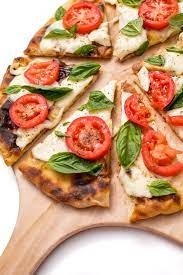Here S How To Make Bobby Flay S Famous Margherita Grilled Pizza Recipe Grilled Pizza Good Pizza Recipes