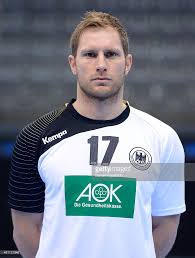 Steffen Weinhold Poses During The Dhb Media Day At Porsche Arena On Poses Porsche Mens Tops