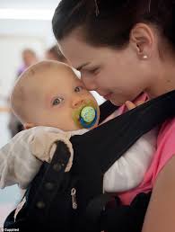 You feel good doing something for yourself': New mothers are taking part in  adorable BABY-WEARING classes to get in shape and bond with their bubs