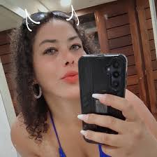 Why were bushes and poles installed around the Dunkin' Donuts parking lot  in East Moriches?