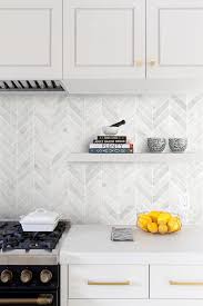 Modern kitchen backsplashes that match home interior decorating style are gorgeous functional decorations that harmonize home interiors. White Modern Marble Chevron Backsplash Tile Backsplash Com In 2020 Kitchen Backsplash Designs Farmhouse Kitchen Backsplash White Tile Kitchen Backsplash