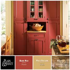 Country Kitchen With Warm Colors Like Barn Reds And Pale Yellows Rustic Kitchen Cabinets Red Kitchen Cabinets Kitchen Armoire