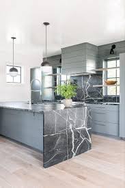 Honed Black Marble Waterfall Island Countertop In A Stunning Gray Kitchen Featuring Two Black An In 2020 Modern Kitchen Design Kitchen Interior Interior Design Kitchen