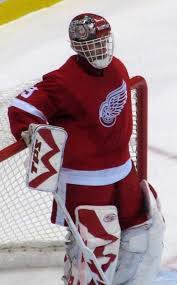 The object is to propel a vulcanized rubber disk, the puck, past a goal line and into a net guarded by a goaltender, or goalie. Dominik Hasek Wikipedie